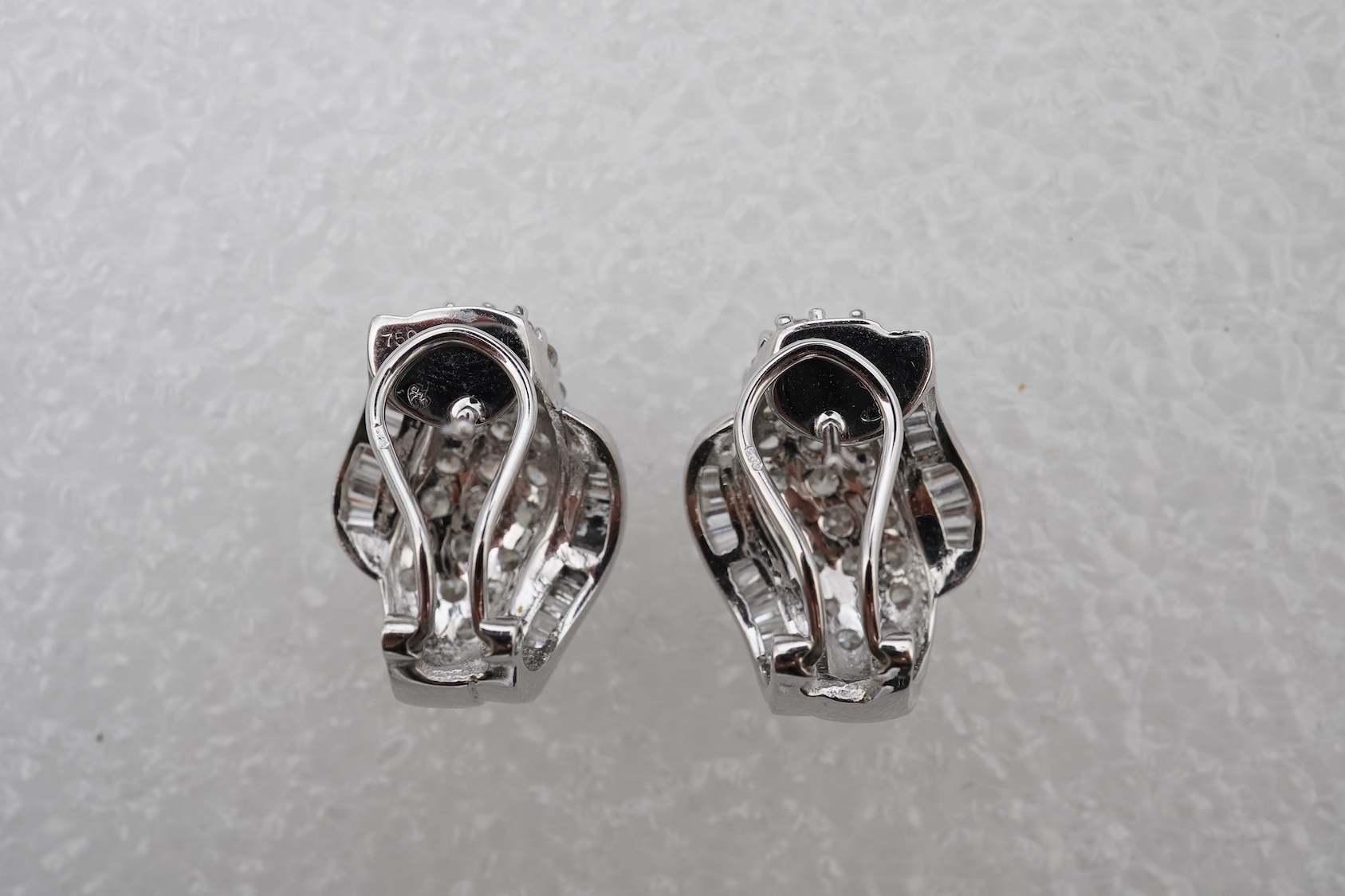 A pair of diamond earrings